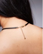 Curve necklace with large hammered floral pendant in gold tone