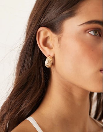 half hoop earrings in textured abstract design in gold tone