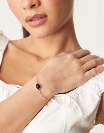 black stone pendant bracelet in gold