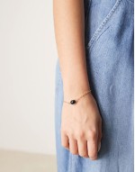 black stone pendant bracelet in gold